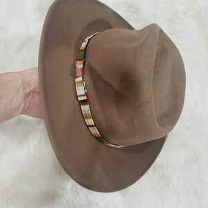 Brown Wide-Brimmed Felt Hat with Decorative Band.